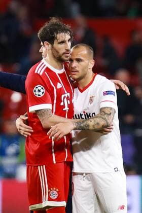 3rd April 2018, Ramon Sanchez Pizjuan, Seville, Spain; UEFA Champions League football, quarter final 1st leg, Sevilla versus Bayern Munich; Javi Martinez of Bayern Munich and Sandro of Sevilla FC hug at the end of the match  ActionPlus12008230