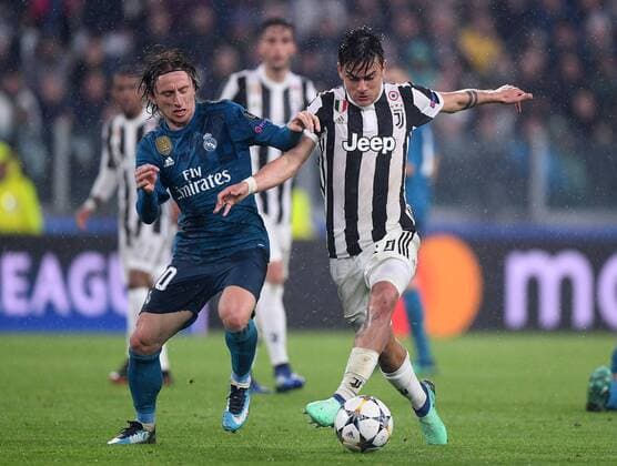 (180404) -- TURIN, April 4, 2018 -- Real Madrid s Luka Modric (L) vies with Juventus Paulo Dybala during the UEFA Champions League quarterfinal first leg soccer match between Juventus and Real Madrid in Turin, Italy, on April 3, 2018. Real Madrid won 3-0.) (wll) (SP)ITALY-TURIN-SOCCER-UEFA-CHAMPIONS LEAGUE-JUVENTUS VS REAL MADRID AlbertoxLingria 