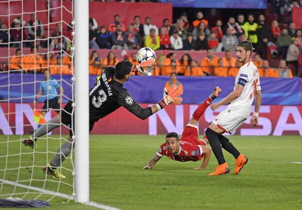 03 04 2018 Football UEFA Champions League 2017 2018 Sevilla quarter-finals FC Bayern Munich at Ramon Sanchez Pizjuan Sevilla Spain Goal scored for Thiago center FC Bayern Munich David Soria left Sevilla and Sergio Escudero re Sevilla FC can not do anything