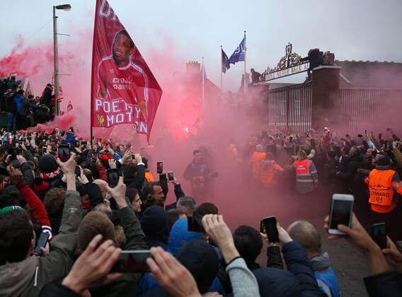 4th April 2018, Anfield, Liverpool, England; UEFA Champions League football, quarter final 1st leg, Liverpool versus Manchester City; Liverpool fans greet the arrival of the team coaches before the match with flares and flags  ActionPlus12008330