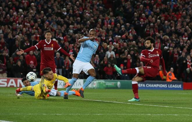 Mohamed Salah of Liverpool scores the first goal past Ederson of Manchester City during the Champions League Quarter Final 1st Leg, match at Anfield Stadium, Liverpool. Picture date: 4th April 2018. Picture credit should read: Simon Bellis Sportimage EDITORIAL USE ONLY. No use with unauthorised audio, video, data, fixture lists, club league logos or live services. Online in-match use limited to 120 images, no video emulation. No use in betting, games or single club league player publications.