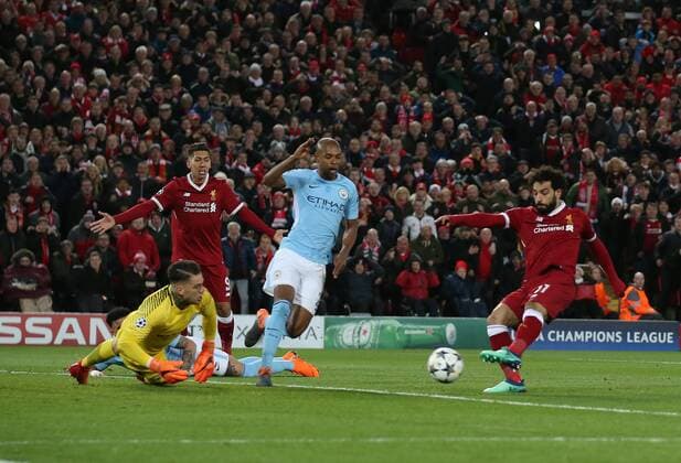 Mohamed Salah of Liverpool scores the first goal past Ederson of Manchester City during the Champions League Quarter Final 1st Leg, match at Anfield Stadium, Liverpool. Picture date: 4th April 2018. Picture credit should read: Simon Bellis Sportimage EDITORIAL USE ONLY. No use with unauthorised audio, video, data, fixture lists, club league logos or live services. Online in-match use limited to 120 images, no video emulation. No use in betting, games or single club league player publications.