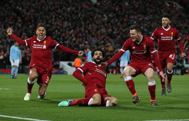 Mohamed Salah of Liverpool (c) celebrates scoring the first goal during the Champions League Quarter Final 1st Leg, match at Anfield Stadium, Liverpool. Picture date: 4th April 2018. Picture credit should read: Simon Bellis Sportimage EDITORIAL USE ONLY. No use with unauthorised audio, video, data, fixture lists, club league logos or live services. Online in-match use limited to 120 images, no video emulation. No use in betting, games or single club league player publications.