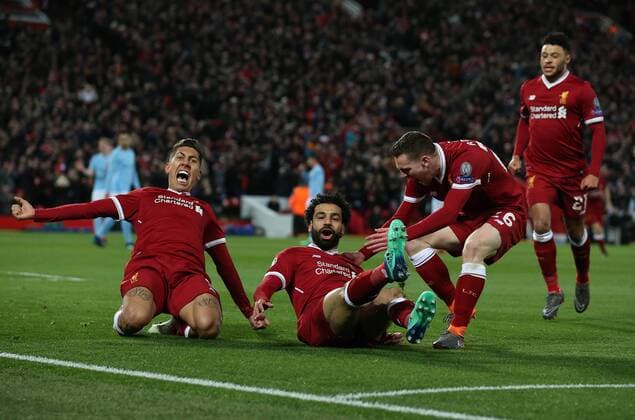 Mohamed Salah of Liverpool (c) celebrates scoring the first goal during the Champions League Quarter Final 1st Leg, match at Anfield Stadium, Liverpool. Picture date: 4th April 2018. Picture credit should read: Simon Bellis Sportimage EDITORIAL USE ONLY. No use with unauthorised audio, video, data, fixture lists, club league logos or live services. Online in-match use limited to 120 images, no video emulation. No use in betting, games or single club league player publications.