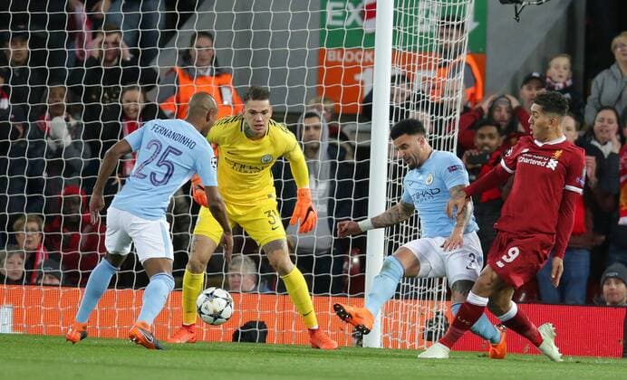 4th April 2018, Anfield, Liverpool, England; UEFA Champions League football, quarter final 1st leg, Liverpool versus Manchester City; Roberto Firmino of Liverpool crosses the ball for Mohammed Salah to score for 1-0 in the 12th minute  ActionPlus12008360