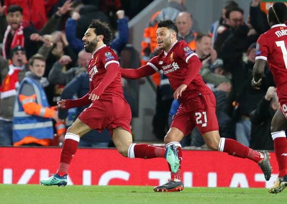 4th April 2018, Anfield, Liverpool, England; UEFA Champions League football, quarter final 1st leg, Liverpool versus Manchester City; Mohammed Salah of Liverpool celebrates his goal in front of the Kop for 1-0 in the 12th minute  ActionPlus12008361
