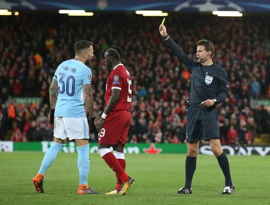 Nicolas Otamendi of Manchester City receives a yellow card during the Champions League Quarter Final 1st Leg, match at Anfield Stadium, Liverpool. Picture date: 4th April 2018. Picture credit should read: Simon Bellis Sportimage EDITORIAL USE ONLY. No use with unauthorised audio, video, data, fixture lists, club league logos or live services. Online in-match use limited to 120 images, no video emulation. No use in betting, games or single club league player publications.