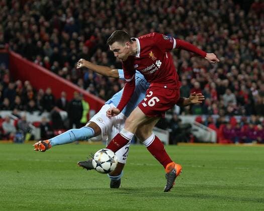 Andrew Robertson of Liverpool has a shot blocked by Fernandinho of Manchester City during the Champions League Quarter Final 1st Leg, match at Anfield Stadium, Liverpool. Picture date: 4th April 2018. Picture credit should read: Simon Bellis Sportimage EDITORIAL USE ONLY. No use with unauthorised audio, video, data, fixture lists, club league logos or live services. Online in-match use limited to 120 images, no video emulation. No use in betting, games or single club league player publications.