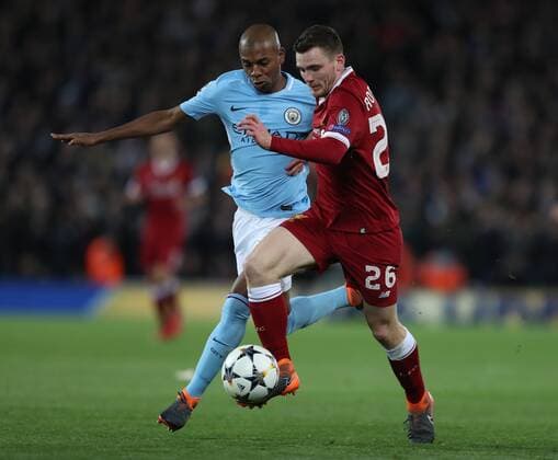 Andrew Robertson of Liverpool takes on Fernandinho of Manchester City during the Champions League Quarter Final 1st Leg, match at Anfield Stadium, Liverpool. Picture date: 4th April 2018. Picture credit should read: Simon Bellis Sportimage EDITORIAL USE ONLY. No use with unauthorised audio, video, data, fixture lists, club league logos or live services. Online in-match use limited to 120 images, no video emulation. No use in betting, games or single club league player publications.