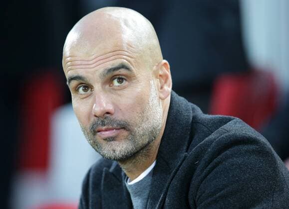 4th April 2018, Anfield, Liverpool, England; UEFA Champions League football, quarter final 1st leg, Liverpool versus Manchester City; Pep Guardiola, manager of Manchester City looks on from his seat in the dugout  ActionPlus12008373