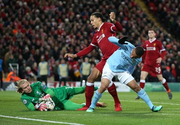 Loris Karius and Virgil van Dijk of Liverpool combine to shut out Gabriel Jesus of Manchester City during the Champions League Quarter Final 1st Leg, match at Anfield Stadium, Liverpool. Picture date: 4th April 2018. Picture credit should read: Simon Bellis Sportimage EDITORIAL USE ONLY. No use with unauthorised audio, video, data, fixture lists, club league logos or live services. Online in-match use limited to 120 images, no video emulation. No use in betting, games or single club league player publications.