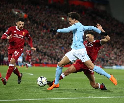 Leroy Sane of Manchester City tacked by Trent Alexander-Arnold of Liverpool during the Champions League Quarter Final 1st Leg, match at Anfield Stadium, Liverpool. Picture date: 4th April 2018. Picture credit should read: Simon Bellis Sportimage EDITORIAL USE ONLY. No use with unauthorised audio, video, data, fixture lists, club league logos or live services. Online in-match use limited to 120 images, no video emulation. No use in betting, games or single club league player publications.