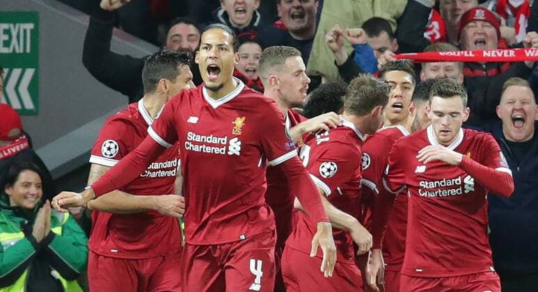 4th April 2018, Anfield, Liverpool, England; UEFA Champions League football, quarter final 1st leg, Liverpool versus Manchester City; the Liverpool players celebrate their 2-0 lead with scorer Alex Oxlade-Chamberlain  ActionPlus12008435