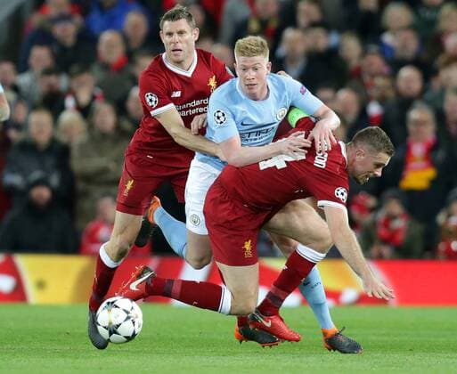 4th April 2018, Anfield, Liverpool, England; UEFA Champions League football, quarter final 1st leg, Liverpool versus Manchester City; Kevin de Bruyne of Manchester City is tackled by James Milner and Jordan Henderson of Liverpool  ActionPlus12008438