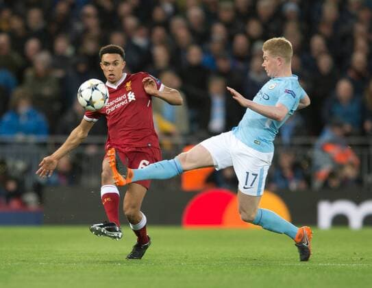Liverpool v Manchester City UEFA Champions League Quarter Final Trent Alexander-Arnold of Liverpool (left) plays the ball as Kevin De Bruyne of Manchester City closes down during the UEFA Champions League Quarter Final match at Anfield, Liverpool Content Not Available For UK Newspapers Copyright: xRussellxHartx FIL-11605-0034