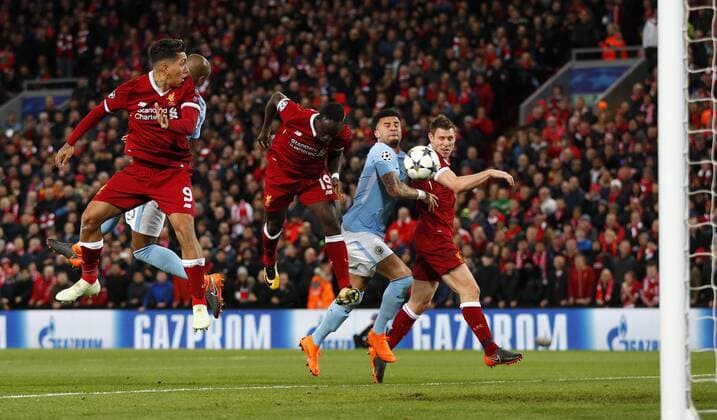 Football - 2017 2018 UEFA Champions League - Quarter-Final, First Leg: Liverpool vs. Manchester City Sadio Mane of Liverpool scores the third goal at Anfield. COLORSPORT LYNNE CAMERON 
