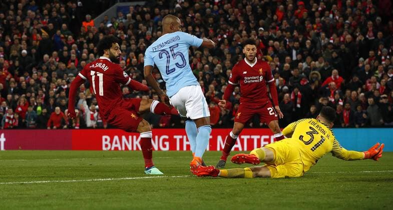 Football - 2017 2018 UEFA Champions League - Quarter-Final, First Leg: Liverpool vs. Manchester City Mohamed Salah of Liverpool scores the first goal at Anfield. COLORSPORT LYNNE CAMERON 