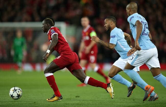4th April 2018, Anfield, Liverpool, England; UEFA Champions League football, quarter final 1st leg, Liverpool versus Manchester City; Sadio Mane of Liverpool sprints away from Raheem Sterling and Fernandinho of Manchester City  ActionPlus12008549