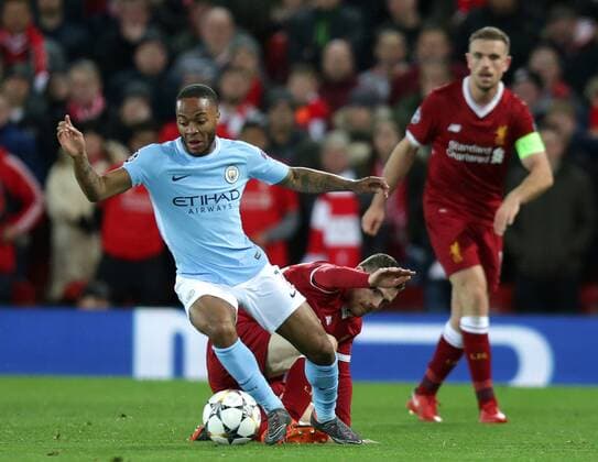 4th April 2018, Anfield, Liverpool, England; UEFA Champions League football, quarter final 1st leg, Liverpool versus Manchester City; Raheem Sterling of Manchester City evades a tackle from Andrew Robertson of Liverpool  ActionPlus12008561