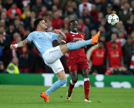 4th April 2018, Anfield, Liverpool, England; UEFA Champions League football, quarter final 1st leg, Liverpool versus Manchester City; Kyle Walker of Manchester City hooks away a clearance from Sadio Mane of Liverpool  ActionPlus12008563