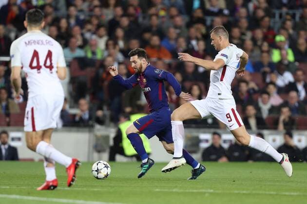 April 4, 2018 - Barcelona, Spain - LIONEL MESSI of FC Barcelona Barca duels for the ball with EDIN DZEKO of AS Roma during the UEFA Champions League, quarter final, 1st leg football match between FC Barcelona and AS Roma on April 4, 2018 at Camp Nou stadium in Barcelona, Spain Football - UEFA Champions League - FC Barcelona vs AS Roma  - ZUMAb169 20180404_zaa_b169_024 Copyright: xManuelxBlondeau Aop.Pressx