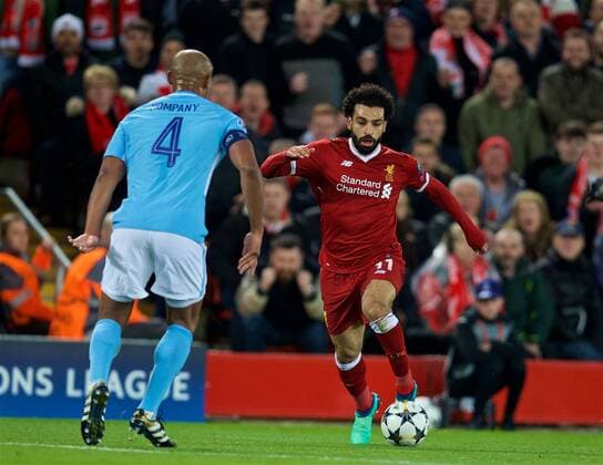 (180405) -- LIVERPOOL, April 5, 2018 -- Mohamed Salah (R) of Liverpool breaks through during the UEFA Champions League quarterfinal 1st Leg match between Liverpool and Manchester City at Anfield Stadium in Liverpool, Britain on April 4, 2018. Liverpool won 3-0. FOR EDITORIAL USE ONLY. NOT FOR SALE FOR MARKETING OR ADVERTISING CAMPAIGNS. NO USE WITH UNAUTHORIZED AUDIO, VIDEO, DATA, FIXTURE LISTS, CLUB LEAGUE LOGOS OR LIVE SERVICES. ONLINE IN-MATCH USE LIMITED TO 45 IMAGES, NO VIDEO EMULATION. NO USE IN BETTING, GAMES OR SINGLE CLUB LEAGUE PLAYER PUBLICATIONS.) (SP)BRITAIN-LIVERPOOL-SOCCER-UEFA CHAMPIONS LEAGUE-LIVERPOOL VS MANCHESTER CITY HanxYan