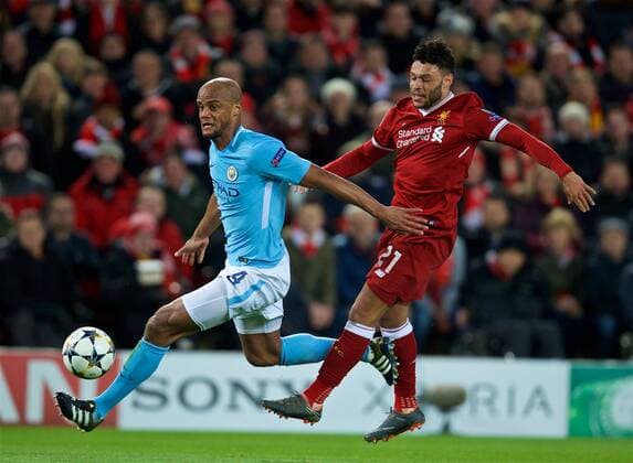 (180405) -- LIVERPOOL, April 5, 2018 -- Vincent Kompany (L) of Manchester City vies with Alex Oxlade-Chamberlain of Liverpool during the UEFA Champions League quarterfinal 1st Leg match between Liverpool and Manchester City at Anfield Stadium in Liverpool, Britain on April 4, 2018. Liverpool won 3-0. FOR EDITORIAL USE ONLY. NOT FOR SALE FOR MARKETING OR ADVERTISING CAMPAIGNS. NO USE WITH UNAUTHORIZED AUDIO, VIDEO, DATA, FIXTURE LISTS, CLUB LEAGUE LOGOS OR LIVE SERVICES. ONLINE IN-MATCH USE LIMITED TO 45 IMAGES, NO VIDEO EMULATION. NO USE IN BETTING, GAMES OR SINGLE CLUB LEAGUE PLAYER PUBLICATIONS.) (SP)BRITAIN-LIVERPOOL-SOCCER-UEFA CHAMPIONS LEAGUE-LIVERPOOL VS MANCHESTER CITY HanxYan