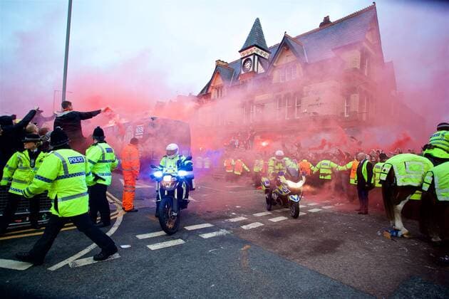 (180405) -- LIVERPOOL, April 5, 2018 -- Liverpool supporters welcome the team buses before the UEFA Champions League quarterfinal 1st Leg match between Liverpool and Manchester City at Anfield Stadium in Liverpool, Britain on April 4, 2018. Liverpool won 3-0. FOR EDITORIAL USE ONLY. NOT FOR SALE FOR MARKETING OR ADVERTISING CAMPAIGNS. NO USE WITH UNAUTHORIZED AUDIO, VIDEO, DATA, FIXTURE LISTS, CLUB LEAGUE LOGOS OR LIVE SERVICES. ONLINE IN-MATCH USE LIMITED TO 45 IMAGES, NO VIDEO EMULATION. NO USE IN BETTING, GAMES OR SINGLE CLUB LEAGUE PLAYER PUBLICATIONS.) (SP)BRITAIN-LIVERPOOL-SOCCER-UEFA CHAMPIONS LEAGUE-LIVERPOOL VS MANCHESTER CITY HanxYan