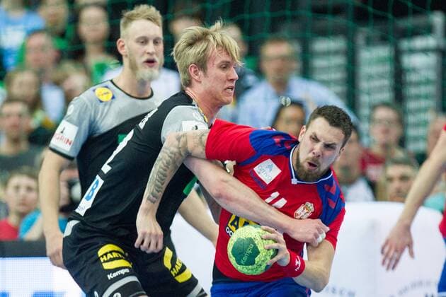 Marian MICHALCZIK li GER vs. Bogdan Radivojevic SRB action duel Handball Laender match of the men Friendlies Germany GER Serbia SRB 26 19 in Leipzig Germany on 04 04 2018 Â