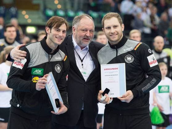 Uwe Gensheimer l GER and Steffen Weinhold r GER are honored by DHB President Andreas Michelmann for their 150 and 100 international matches Handball Laenderspiel Germany Serbia in Leipzig Germany
