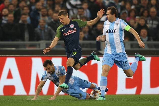 SOCCER - EL, Lazio vs RBS ROME,ITALY,05.APR.18 - SOCCER - UEFA Europa League, quarterfinal, SS Lazio vs Red Bull Salzburg. Image shows Stefan Radu (Lazio), Stefan Lainer (RBS) and Senad Lulic (Lazio). GEPAxpictures xMathiasxMandl