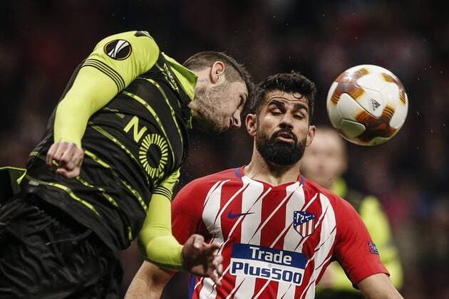 5th April 2018, Wanda Metropolitano, Madrid, Spain; UEFA Europa League football, quarter final, 1st leg, Atletico Madrid versus Sporting Lisbon; Cristiano Piccini (Sporting de Portugal) fights for the header with Diego Costa (Atletico de Madrid)  ActionPlus12008989