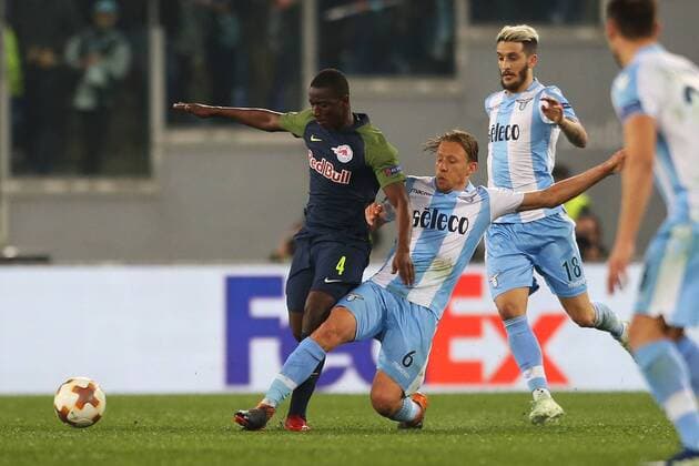 SOCCER - EL, Lazio vs RBS ROME,ITALY,05.APR.18 - SOCCER - UEFA Europa League, quarterfinal, SS Lazio vs Red Bull Salzburg. Image shows Amadou Haidara (RBS) and Lucas Leiva Pezzini (Lazio). GEPAxpictures xMathiasxMandl