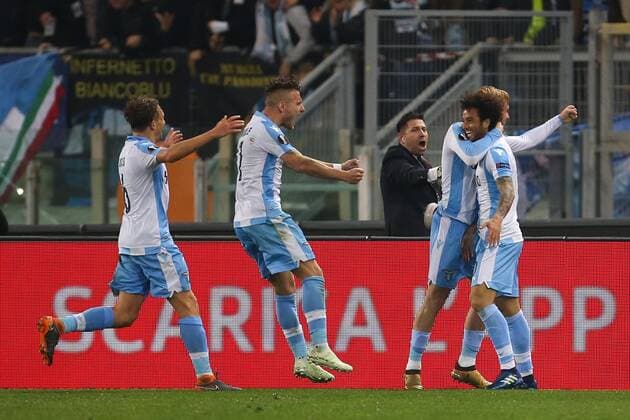 5th April 2018, Stadio Olimpico, Rome, Italy; UEFA Europa League football, quarter final, 1st leg, Lazio versus FC Salzburg; Felipe Anderson (R) of Lazio celebrates with teammates after scoring a goal in the 74th minute for 3-2  ActionPlus12009045