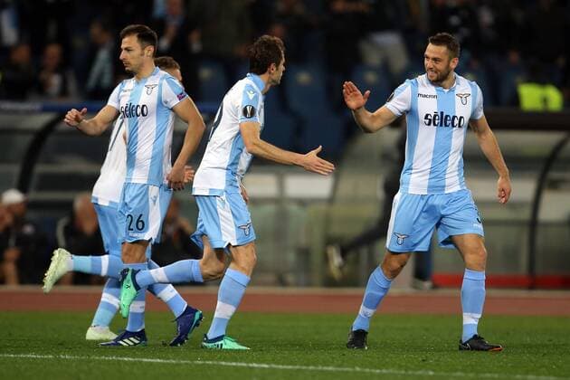 5th April 2018, Stadio Olimpico, Rome, Italy; UEFA Europa League football, quarter final, 1st leg, Lazio versus FC Salzburg; Senad Lulic (2R) of Lazio celebrates with teammates Stefan Radu (L), Ciro Immobile (2L) and Stefan De Vrij (R) after scoring a goal in the 8th minute  ActionPlus12009017