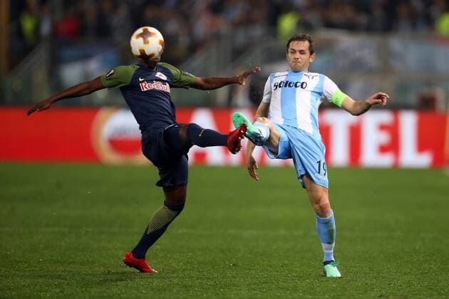 5th April 2018, Stadio Olimpico, Rome, Italy; UEFA Europa League football, quarter final, 1st leg, Lazio versus FC Salzburg; (L-R) Amadou Haidara of Salzburg challenges Senad Lulic of Lazio  ActionPlus12009024