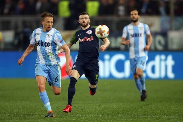 5th April 2018, Stadio Olimpico, Rome, Italy; UEFA Europa League football, quarter final, 1st leg, Lazio versus FC Salzburg; (L-R) Lucas Leiva of Lazio challenges Valon Berisha of Salzburg  ActionPlus12009032