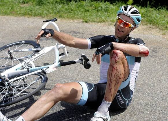 - PLATEAU DE BEILLE, FRANCE: German Jens Voigt of team Leopard - Trek lies injured on the ground during the fourteenth stage of the Tour de France cycling race, 168,5 km from Saint-Gaudens and Plateau de Beille, in France, Saturday 16 July 2011. The 98th Tour de France ends on the Champs-Elysees in Paris on 24 July. ERICxLALMAND  x28225890x