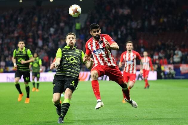 (180406) -- MADRID, April 6, 2018 -- Atletico Madrid s Diego Costa (R) and Sporting Lisboa s Sebastian Coates compete during the UEFA Europa League quarter-final first leg soccer match between Atletico Madrid and Sporting Lisboa in Madrid, Spain, on April 5, 2018. Atletico Madrid won 2-0. ) (SP)SPAIN-MADRID-SOCCER-UEFA-EUROPA-QUARTERFINAL-ATLETICO VS SPORTING EdwardxPetersxLopez 