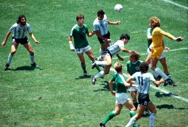 FIFA World Cup WM Weltmeisterschaft Fussball - Mexico 1986 29.6.1986, Estadio Azteca, Mexico, D.F. Final Argentina v West Germany. Jos Luis Brown heads the first goal for Argentina in the 23rd minute. German goalkeeper Harald Toni Schumacher came out catching butterflies . In front of Brown is Diego Maradona, behind Thomas Berthold (14). Watching on left is Sergio Batista. Noxthirdxpartyxsales  (75095834)