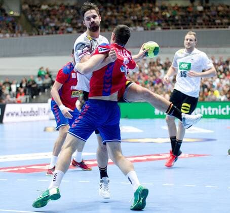 Fabian Wiede Nr 10 Germany is stopped by Drasko Nenadic Nr 31 Serbia Germany Serbia Dortmund Copyright: xDanielxReinelt xEibner-Pressefotx EP_drt