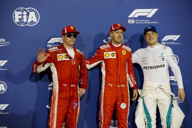 Kimi Raikkonen of Scuderia Ferrari with Sebastian Vettel of Scuderia Ferrari and Valtteri Bottas of Mercedes AMG Petronas Motorsport after the qualifying session of the Bahrain Formula One Grand Prix at the Bahrain International Circuit in Sakhir, Bahrain on 7 April 2018. Copyright: xJamesxGasperottix 19520144