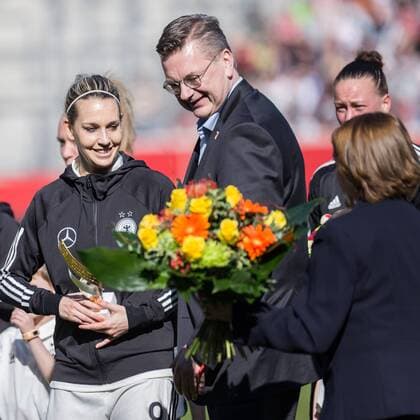 Lena Goeßling GER 8 is honored for her 100 international match. Lena Goeßling GER 8 Reinhard Dieter Grindel DFB President Hannelore Ratzeburg DFB Vice President for Women and Girls Soccer Football Women International match Germany Czech Republic xprx