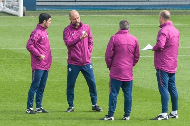 Manchester City Training Manchester City manager Josep Guardiola chats with coaching staff during the Manchester City training session at City Football Academy, Manchester Content Not Available For UK Newspapers Copyright: xMattxWilkinsonx FIL-11627-0002