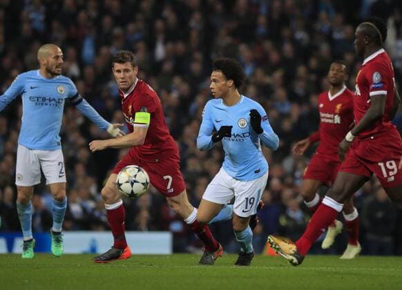 10th April 2018, Etihad Stadium, Manchester, England; UEFA Champions League football, quarter final, second leg; Manchester City verses Liverpool; Leroy Sane of Manchester City moves the ball forward watched by James Milner of Liverpool  ActionPlus12011650