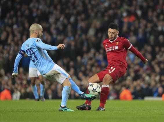 10th April 2018, Etihad Stadium, Manchester, England; UEFA Champions League football, quarter final, second leg; Manchester City verses Liverpool; Alex Oxlade-Chamberlain of Liverpool and David Silva of Manchester City challenge for the ball  ActionPlus12011656