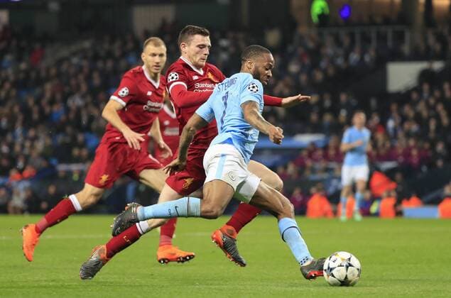 10th April 2018, Etihad Stadium, Manchester, England; UEFA Champions League football, quarter final, second leg; Manchester City verses Liverpool; Raheem Sterling of Manchester City is challenged by Andrew Robertson of Liverpool  ActionPlus12011855