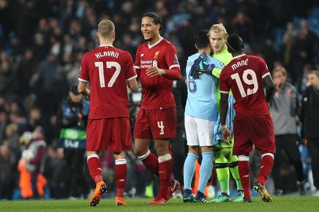 Manchester City v Liverpool UEFA Champions League Quarter Final Virgil van Dijk of Liverpool celebrates with Ragnar Klavan after their teams win against Manchester City in the UEFA Champions League Quarter Final match at the Etihad Stadium, Manchester. Content Not Available For UK Newspapers Copyright: xMichaelxSedgwickx FIL-11629-0053