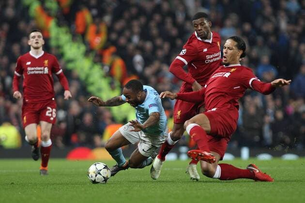 Manchester City v Liverpool UEFA Champions League Quarter Final Raheem Sterling of Manchester City goes down after a tackle by Virgil van Dijk of Liverpool during the UEFA Champions League Quarter Final match at the Etihad Stadium, Manchester. Content Not Available For UK Newspapers Copyright: xMichaelxSedgwickx FIL-11629-0062