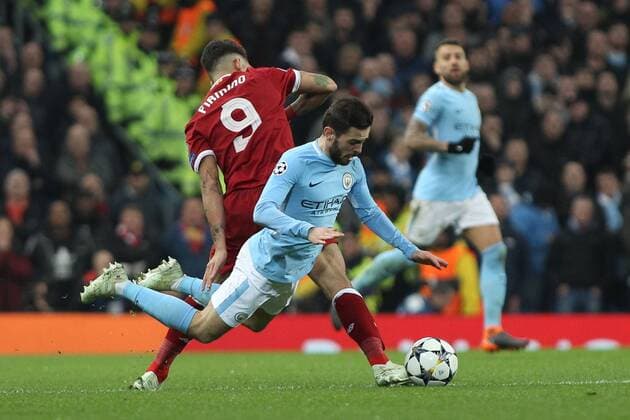 Manchester City v Liverpool UEFA Champions League Quarter Final Bernardo Silva of Manchester City is fouled by Roberto Firmino of Liverpool during the UEFA Champions League Quarter Final match at the Etihad Stadium, Manchester. Content Not Available For UK Newspapers Copyright: xMichaelxSedgwickx FIL-11629-0067